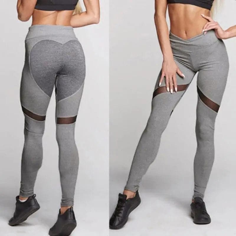 Leggings d’athlétisme gris avec empiècements en maille et panneaux colorés.