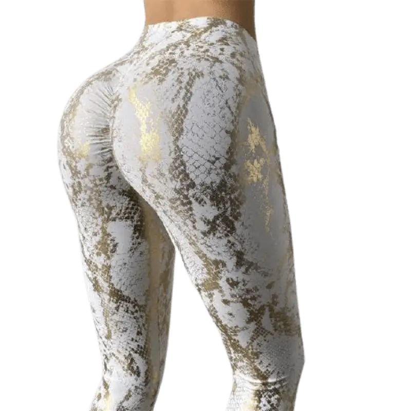 Leggings ou pantalons de yoga à motifs marbrés blanc et or.