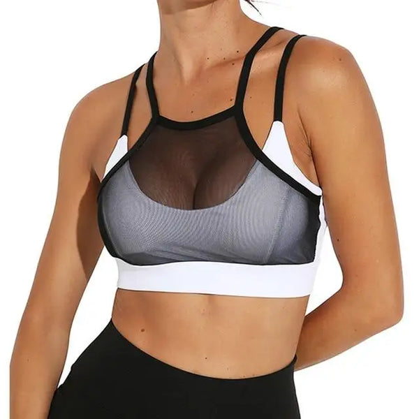 Soutien-gorge de sport avec empiècement en maille et motif contrasté noir et blanc.